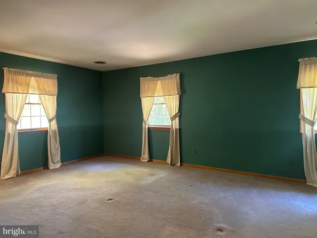 an empty room with windows