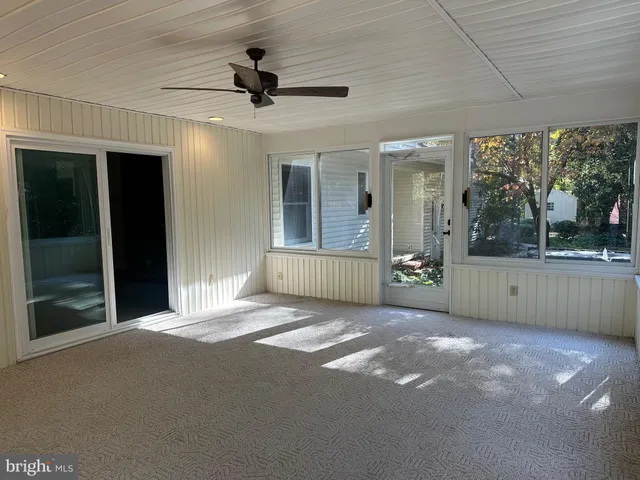a view of a porch with a floor to ceiling window