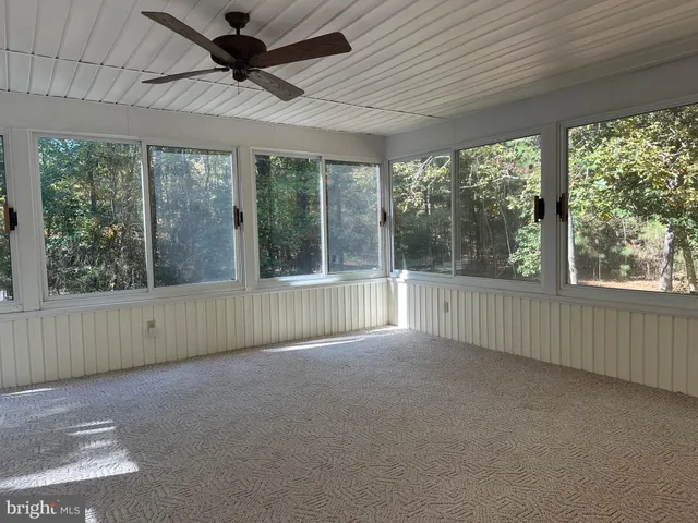 a view of a room with a large window