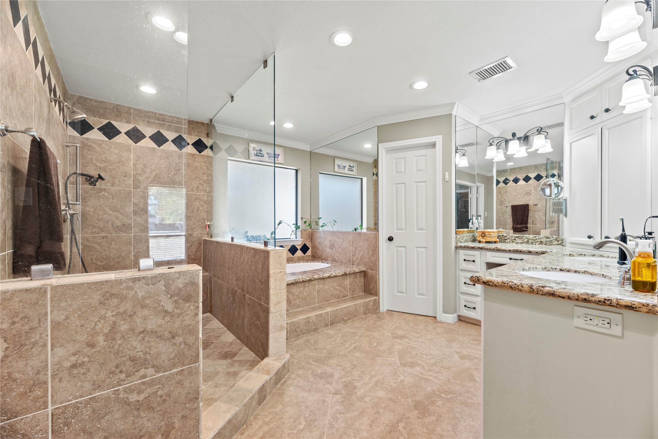 1203 Lemm Road 2 Spring, TX 77373 - Photo 10 of 21 Indulge in the spa-like primary bath complete with a jetted soaking tub, separate shower, and double sinks on an L-shaped vanity.