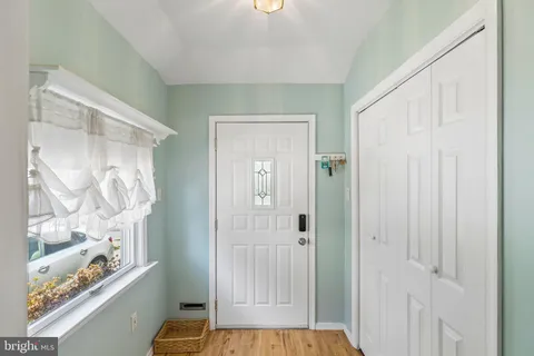 a view of front door with wooden floor