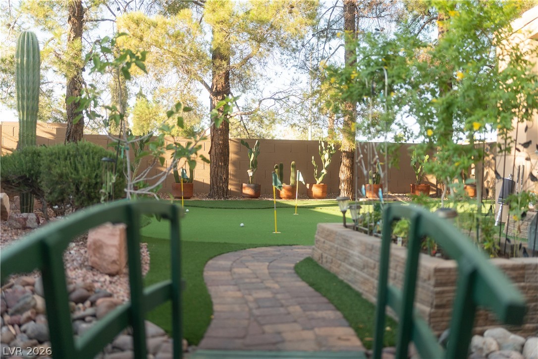 2108 Inverness Drive Henderson, NV 89074 - Photo 11 of 46 Surrounding community featuring a putting green and a fenced backyard