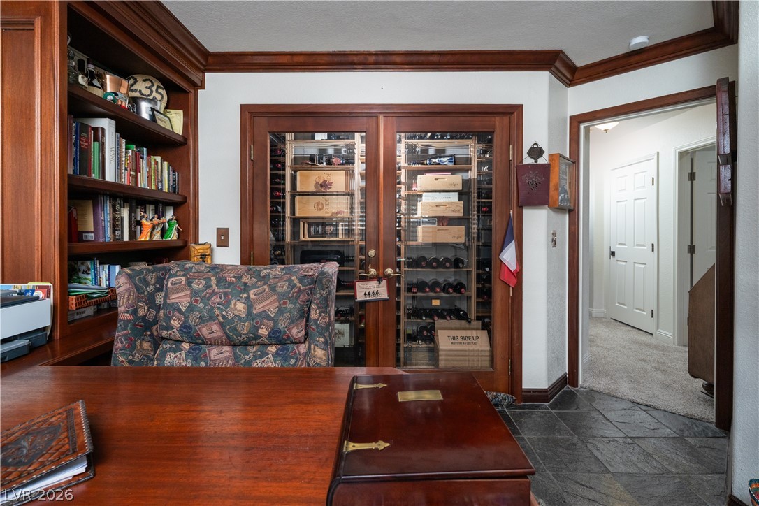 2108 Inverness Drive Henderson, NV 89074 - Photo 28 of 46 Office area featuring crown molding and baseboards