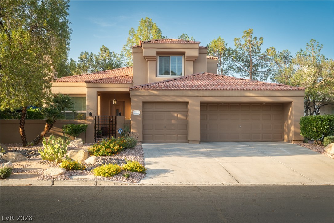 2108 Inverness Drive Henderson, NV 89074 - Photo 40 of 46 Mediterranean / spanish-style home with an attached garage, driveway, stucco siding, and a tiled roof