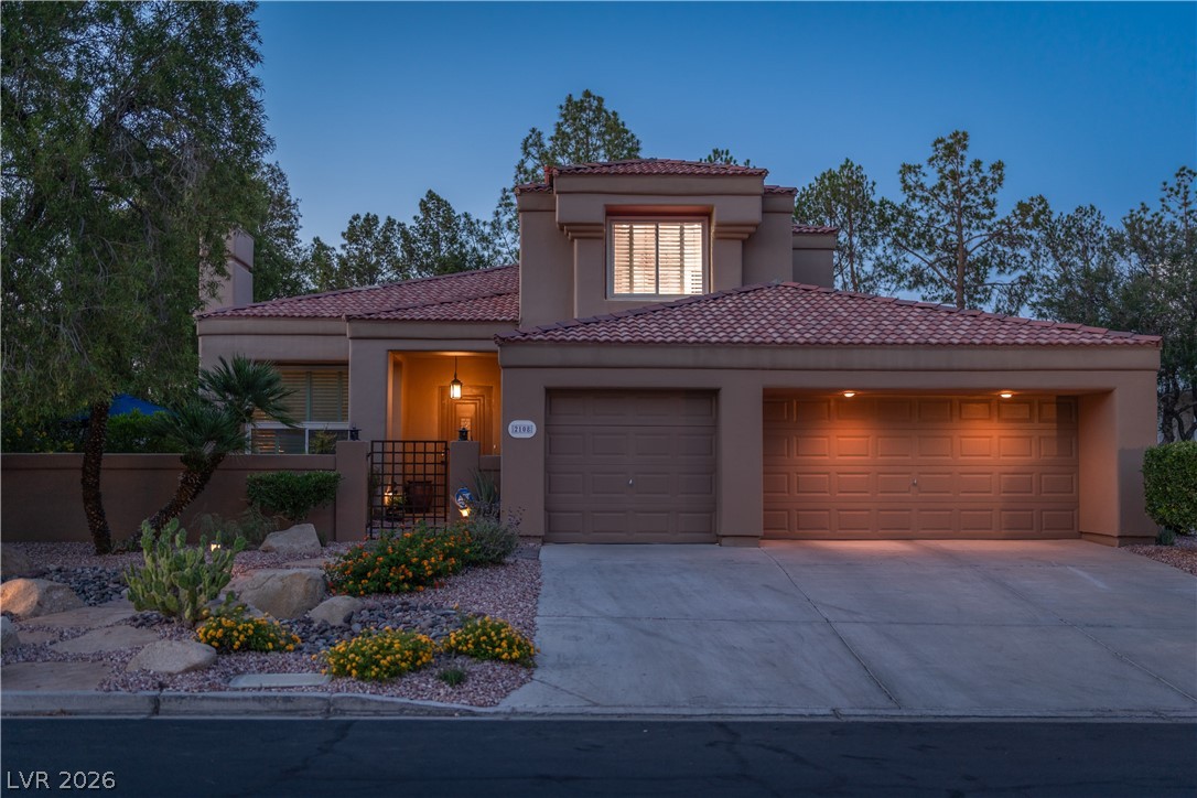 2108 Inverness Drive Henderson, NV 89074 - Photo 45 of 46 Mediterranean / spanish-style home with a garage, stucco siding, driveway, and a tile roof