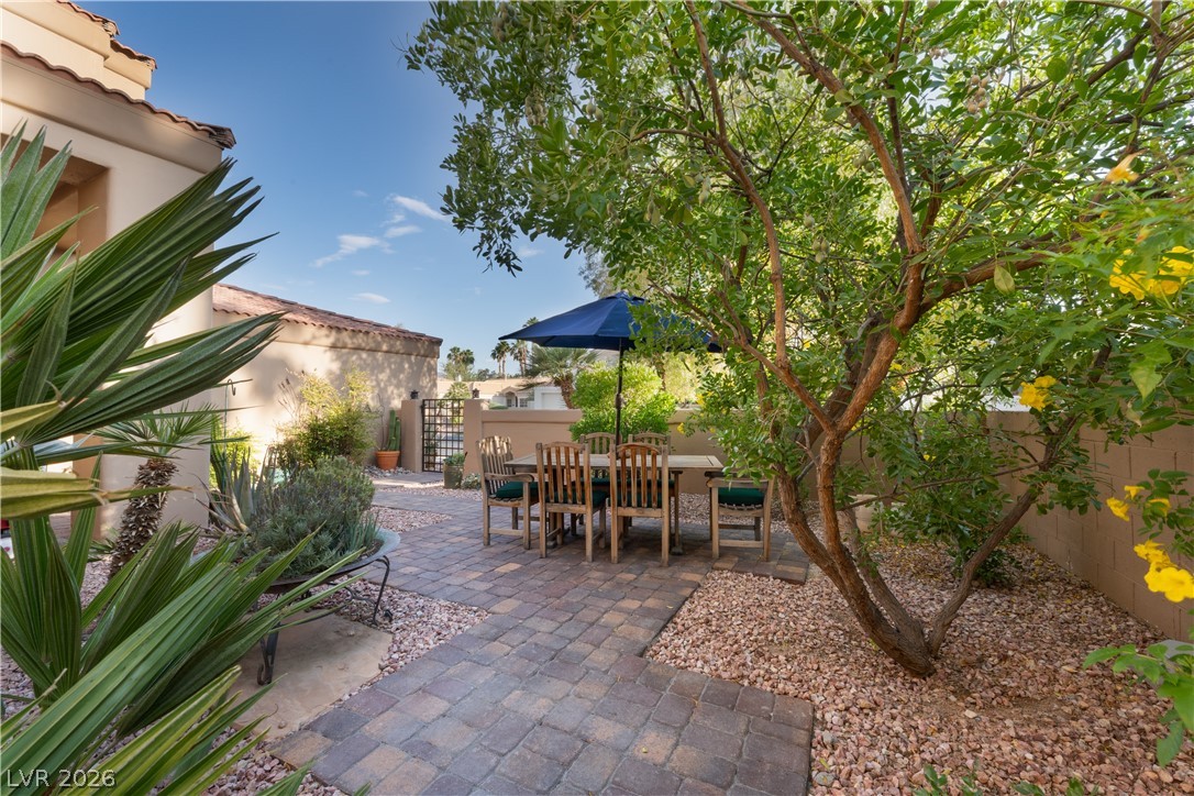 2108 Inverness Drive Henderson, NV 89074 - Photo 9 of 46 Fenced backyard featuring outdoor dining space and a patio area