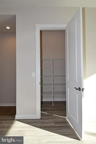 a large kitchen with kitchen island a sink stainless steel appliances and cabinets