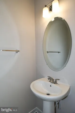 a bathroom with a sink and mirror
