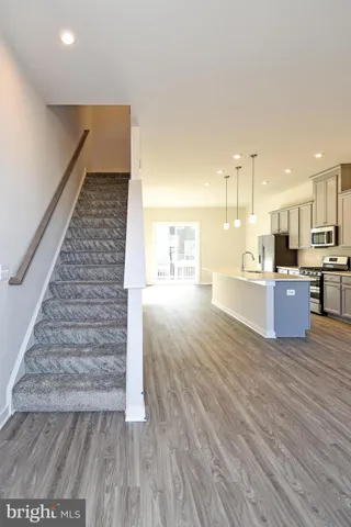 a view of a brick house with large windows