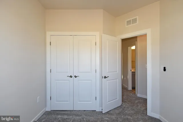 a view of yard with swimming pool and seating