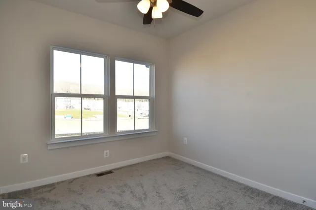 a living room with fireplace furniture and a flat screen tv