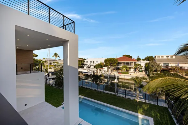a view of a kitchen with a sink and cabinets