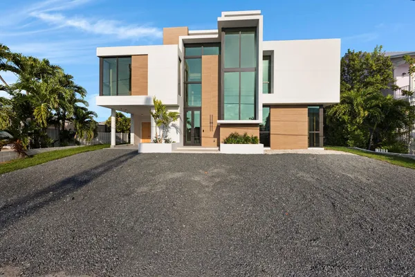 a bathroom with a double vanity sink and a large mirror