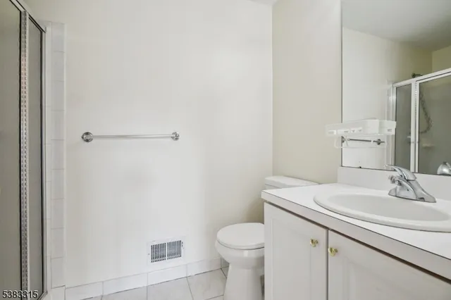 a bathroom with a sink toilet and vanity