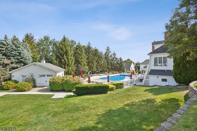 a view of a house with a yard porch and sitting area
