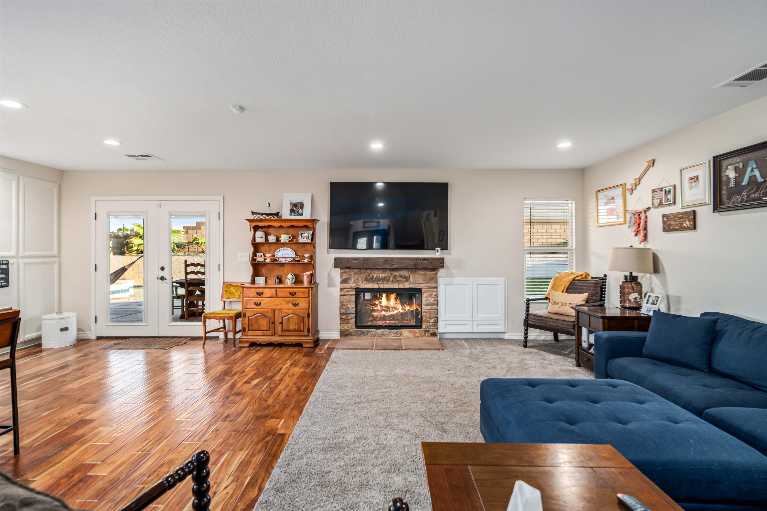 6204 Shadow Hill Drive Lancaster, CA 93536 - Photo 16 of 82 a living room with fireplace furniture and a flat screen tv