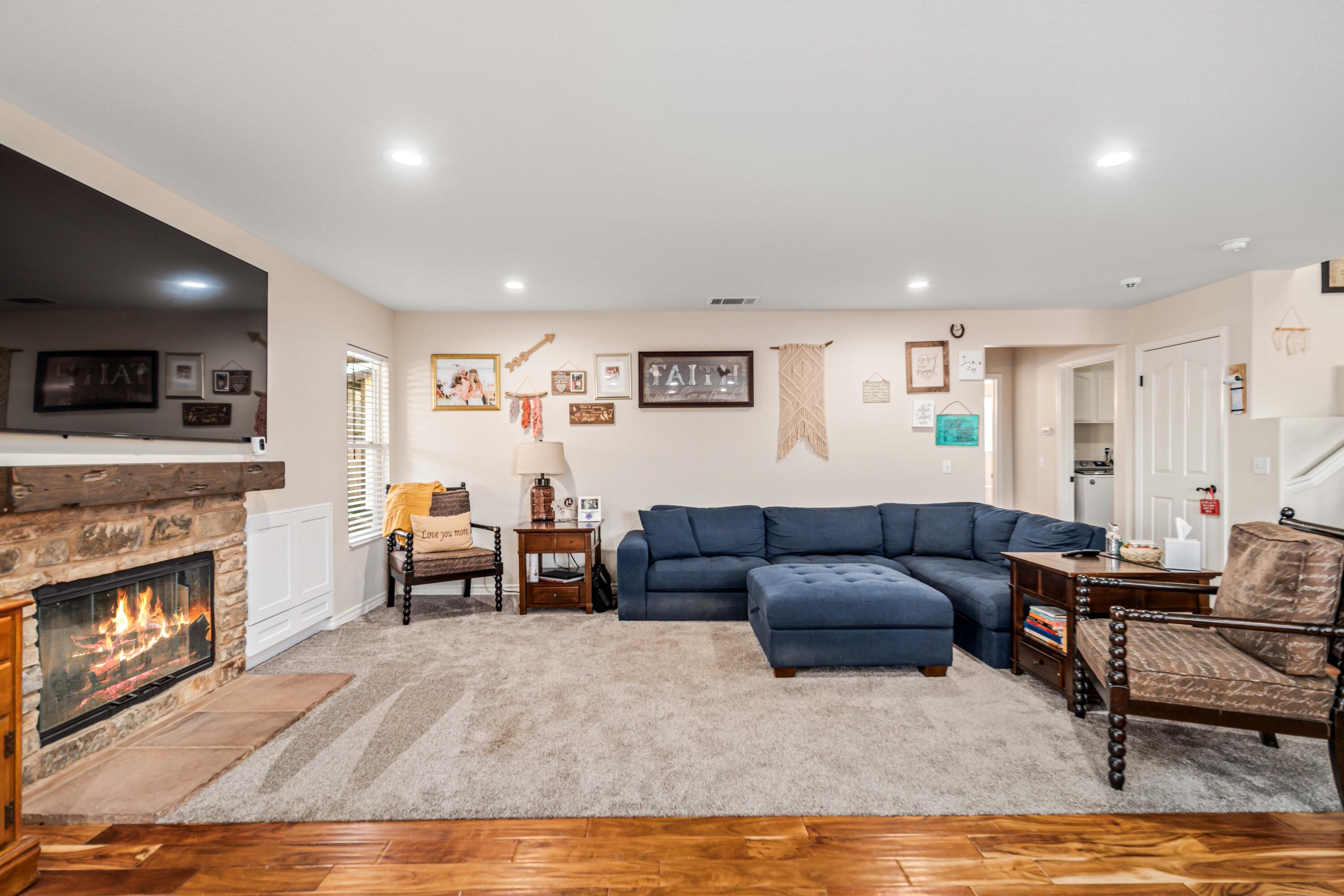 6204 Shadow Hill Drive Lancaster, CA 93536 - Photo 17 of 82 a living room with furniture and a fireplace