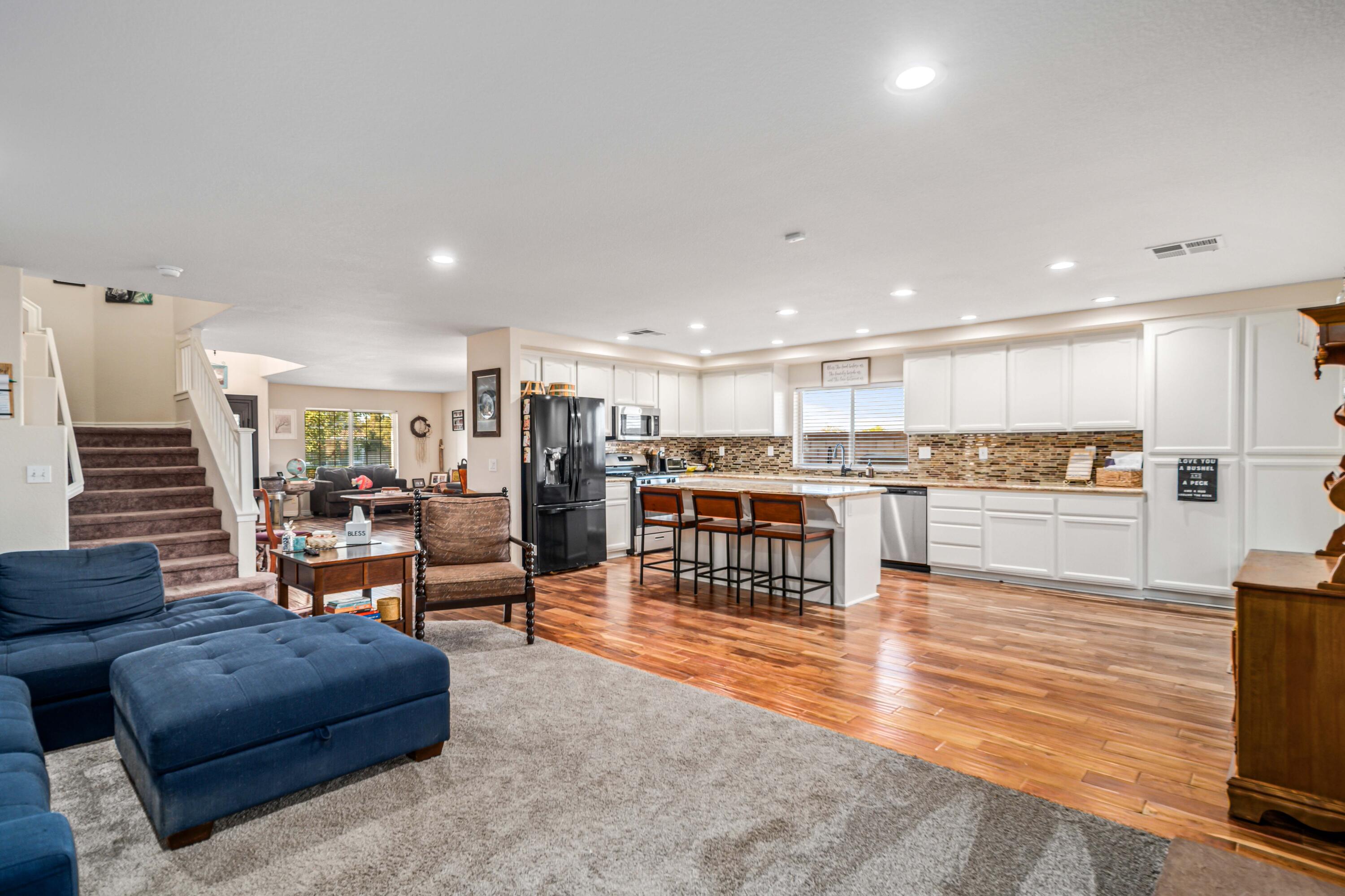 6204 Shadow Hill Drive Lancaster, CA 93536 - Photo 18 of 82 a living room with furniture and kitchen view