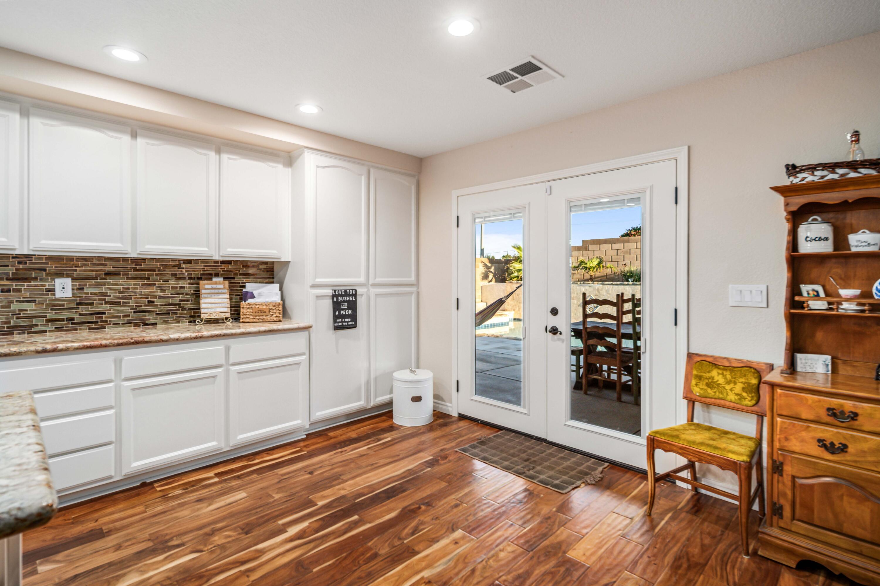6204 Shadow Hill Drive Lancaster, CA 93536 - Photo 23 of 82 a kitchen with granite countertop a refrigerator and a sink