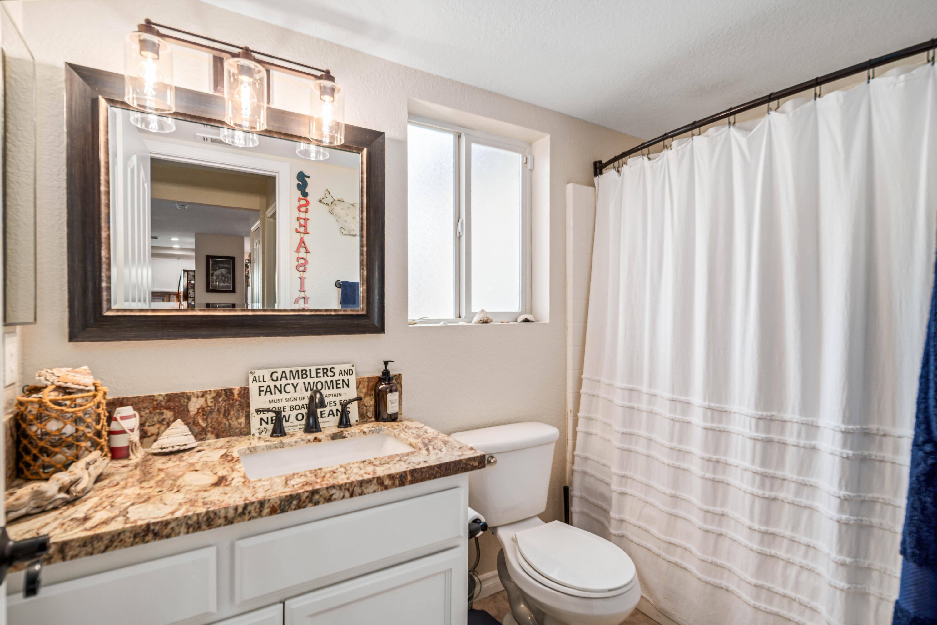 6204 Shadow Hill Drive Lancaster, CA 93536 - Photo 26 of 82 a bathroom with a granite countertop sink mirror vanity and toilet
