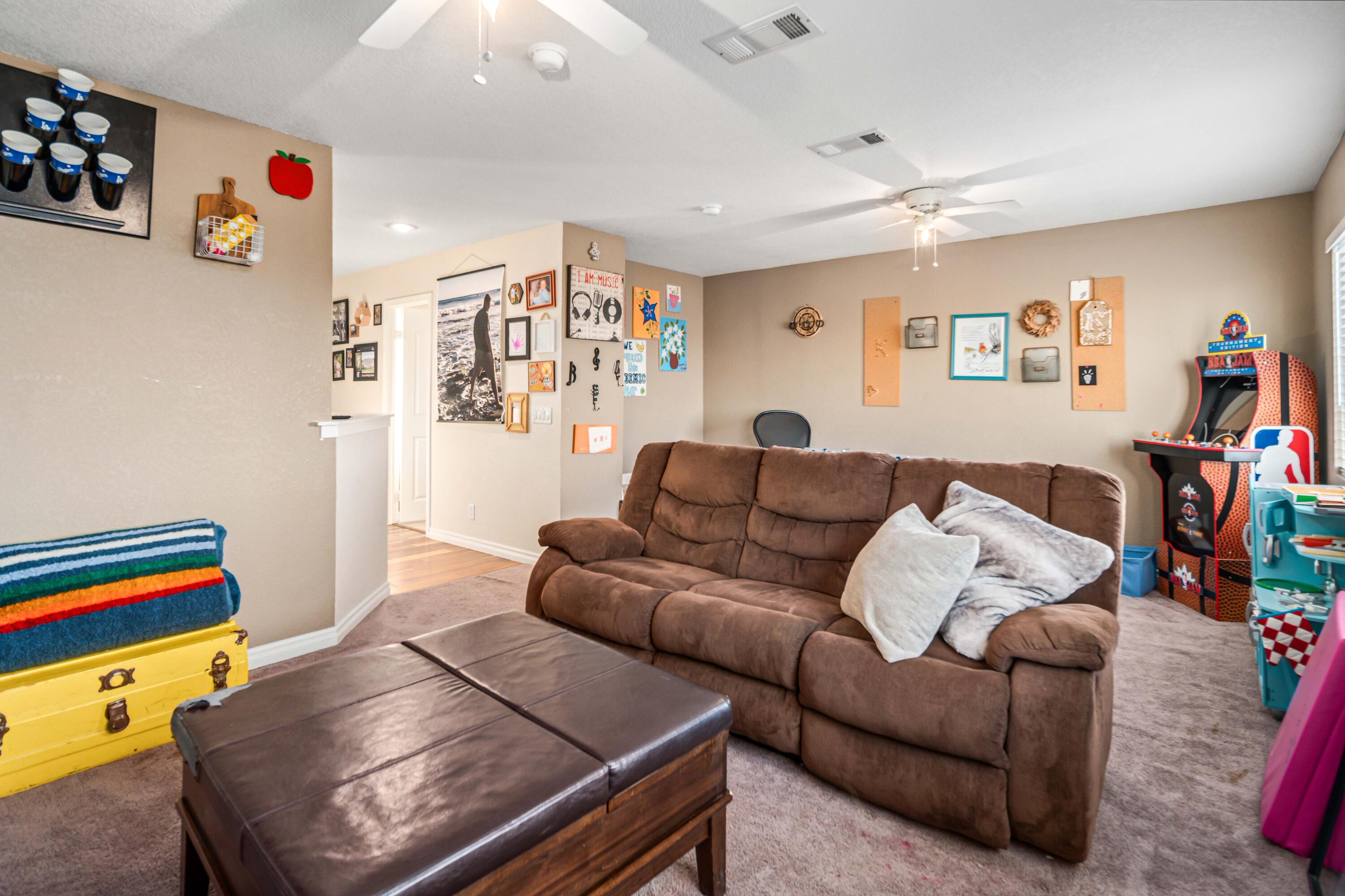 6204 Shadow Hill Drive Lancaster, CA 93536 - Photo 30 of 82 a living room with furniture and a couch