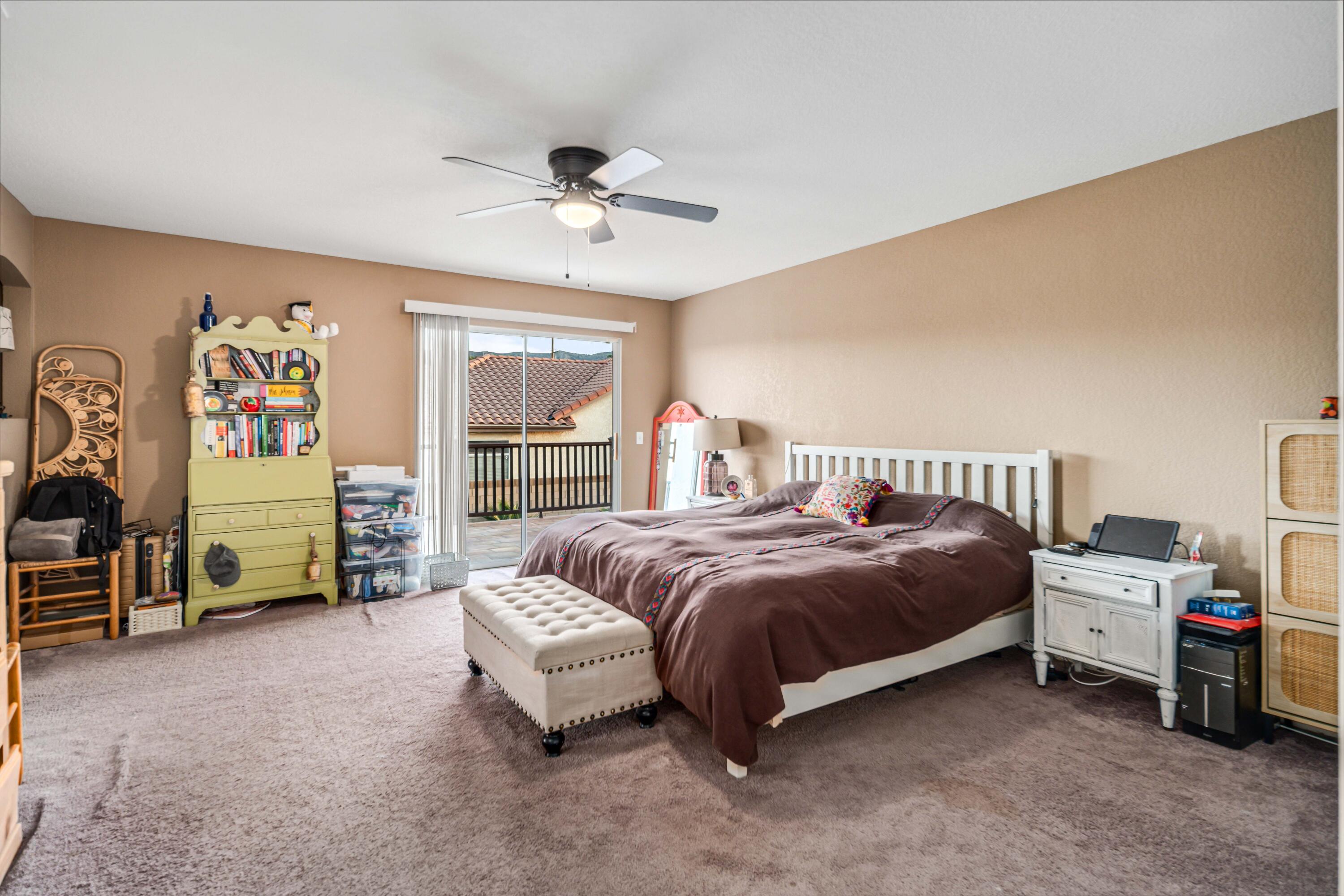 6204 Shadow Hill Drive Lancaster, CA 93536 - Photo 32 of 82 a spacious bedroom with a bed and a desk