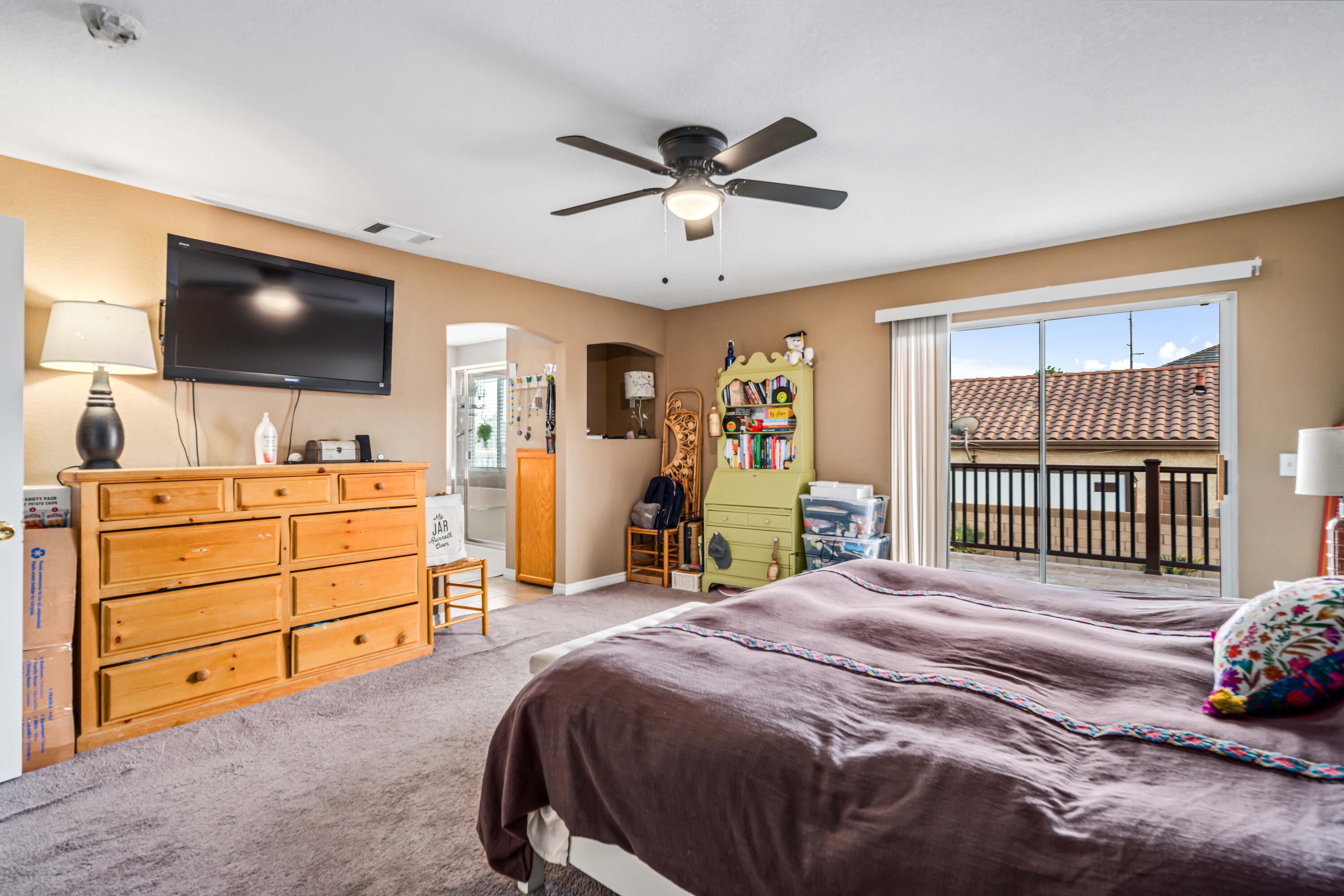 6204 Shadow Hill Drive Lancaster, CA 93536 - Photo 33 of 82 a bedroom with a bed and a flat screen tv