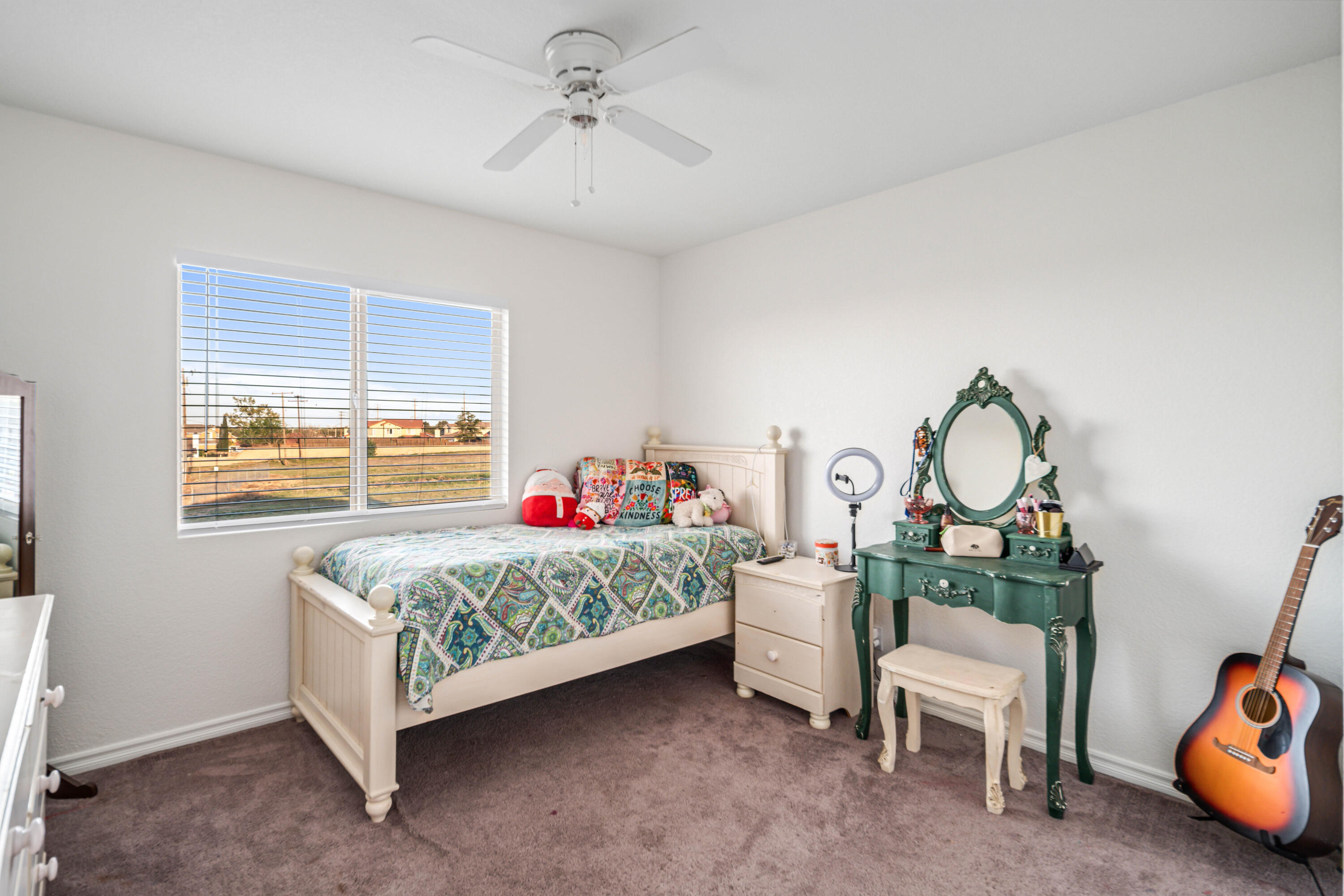 6204 Shadow Hill Drive Lancaster, CA 93536 - Photo 40 of 82 a bedroom with a bed a chandelier and a dresser