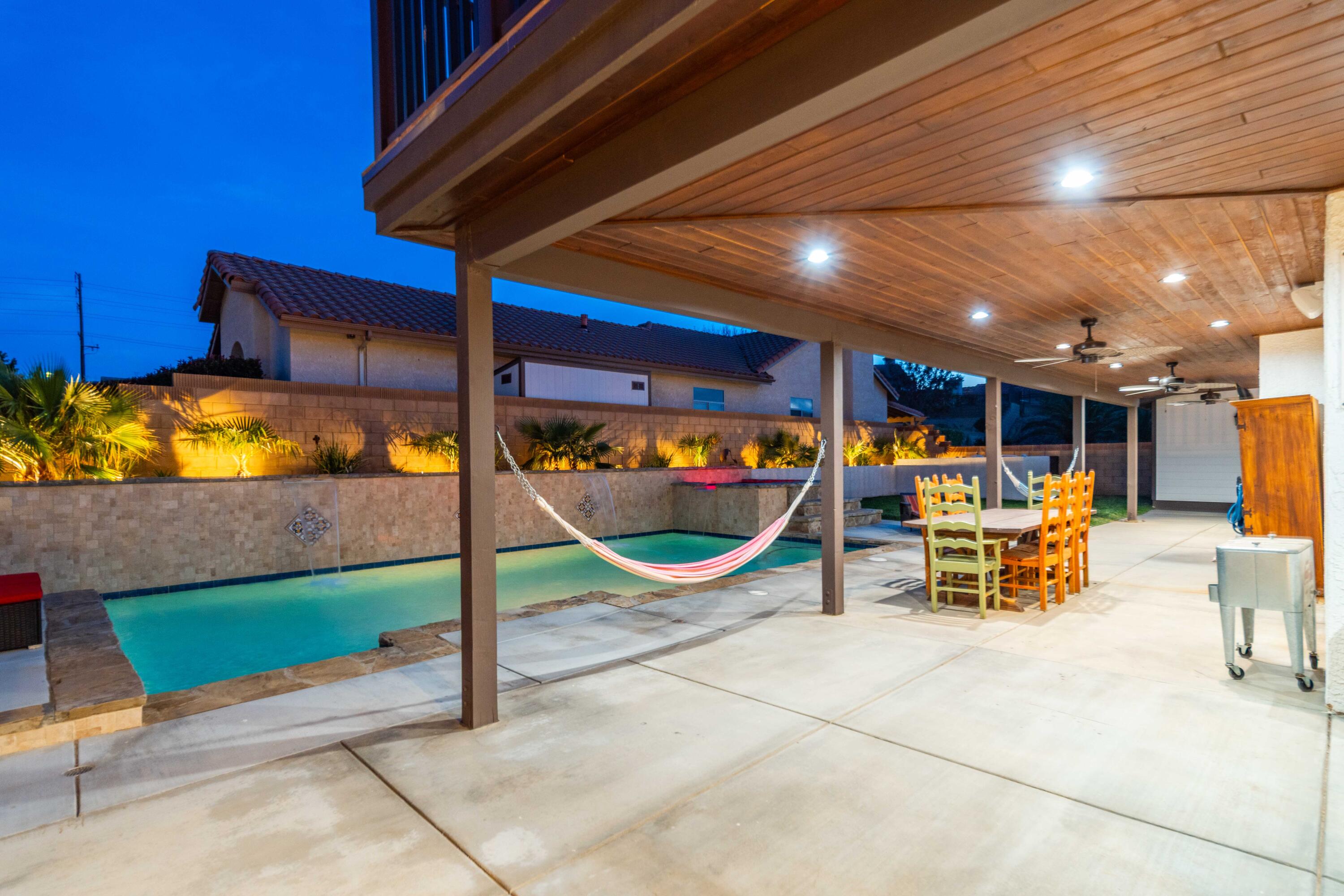 6204 Shadow Hill Drive Lancaster, CA 93536 - Photo 48 of 82 a view of a patio with a table and chairs