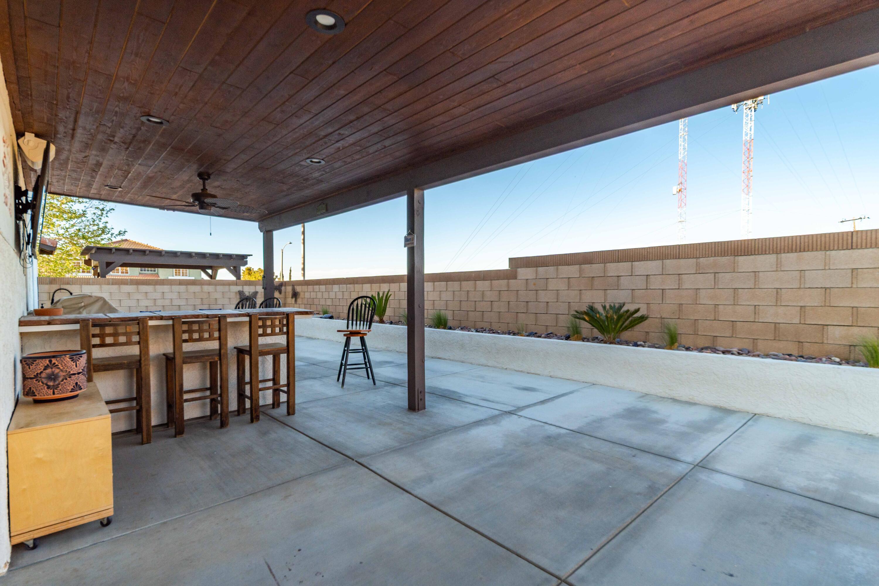 6204 Shadow Hill Drive Lancaster, CA 93536 - Photo 50 of 82 a view of a patio with table and chairs