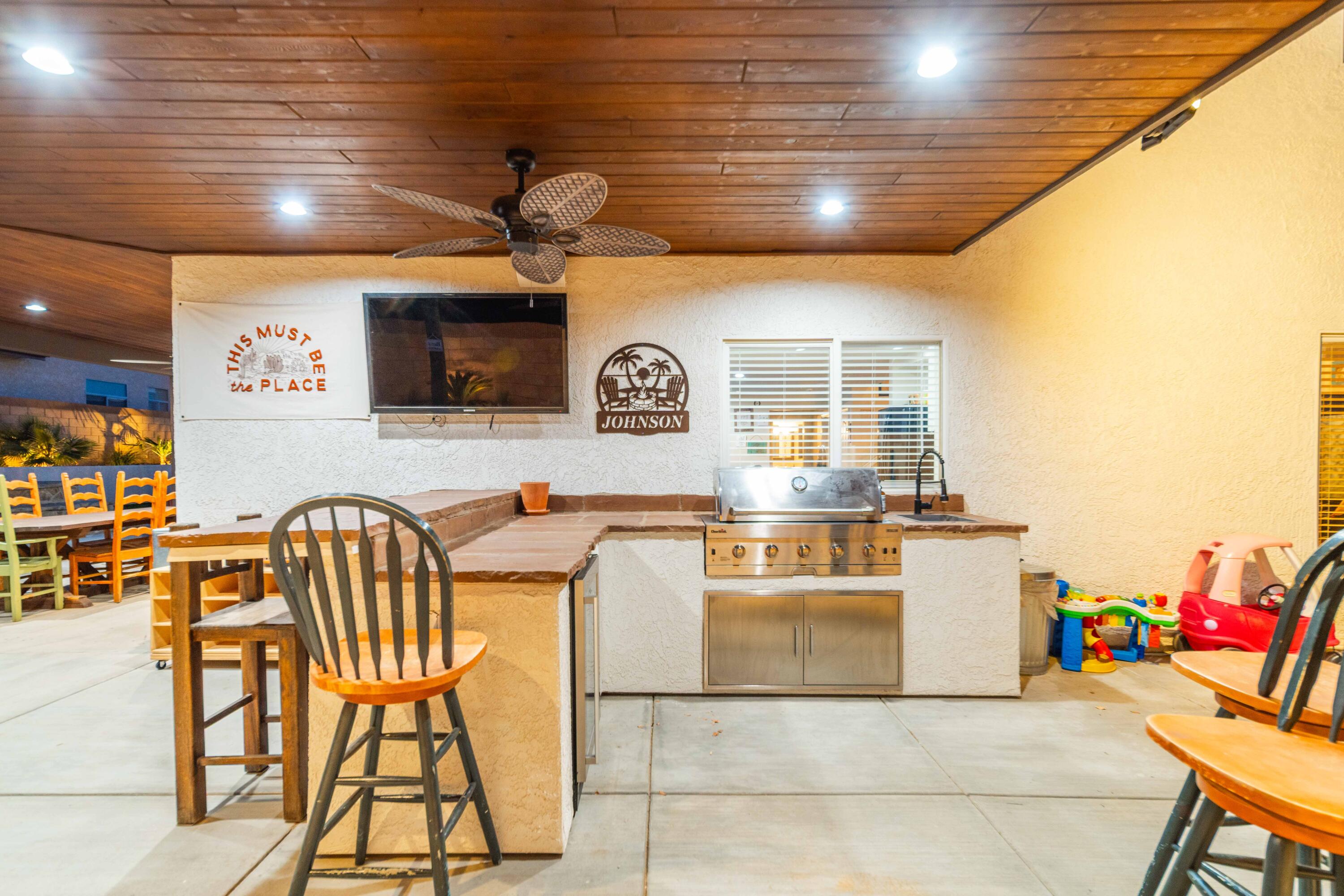 6204 Shadow Hill Drive Lancaster, CA 93536 - Photo 53 of 82 a kitchen with stainless steel appliances kitchen island granite countertop a table chairs and a refrigerator
