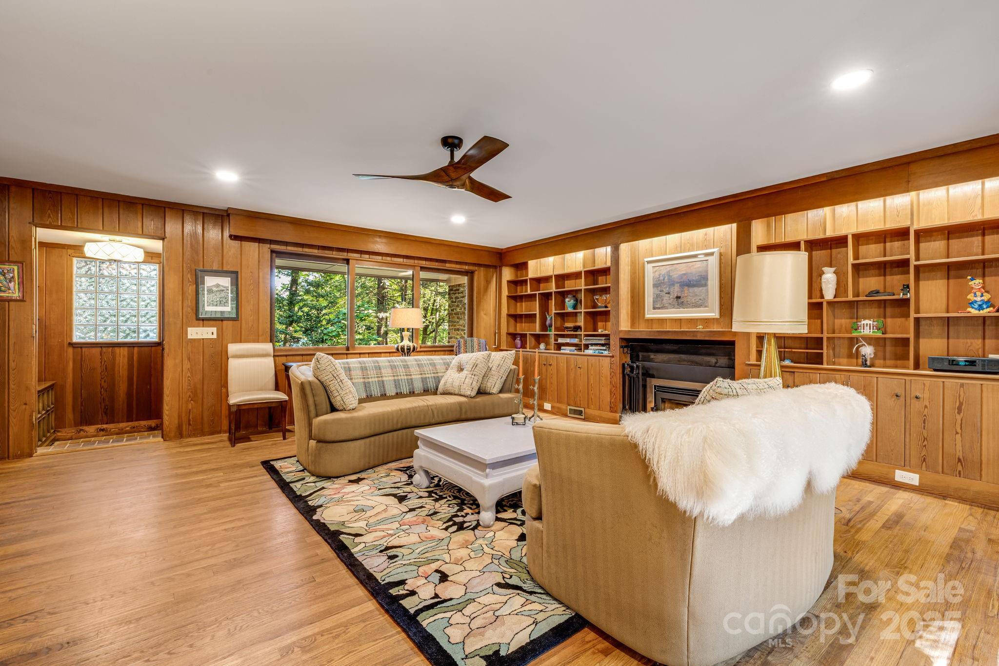 750 Braewick Road Tryon, NC 28782 - Photo 13 of 43 a living room with furniture and large windows