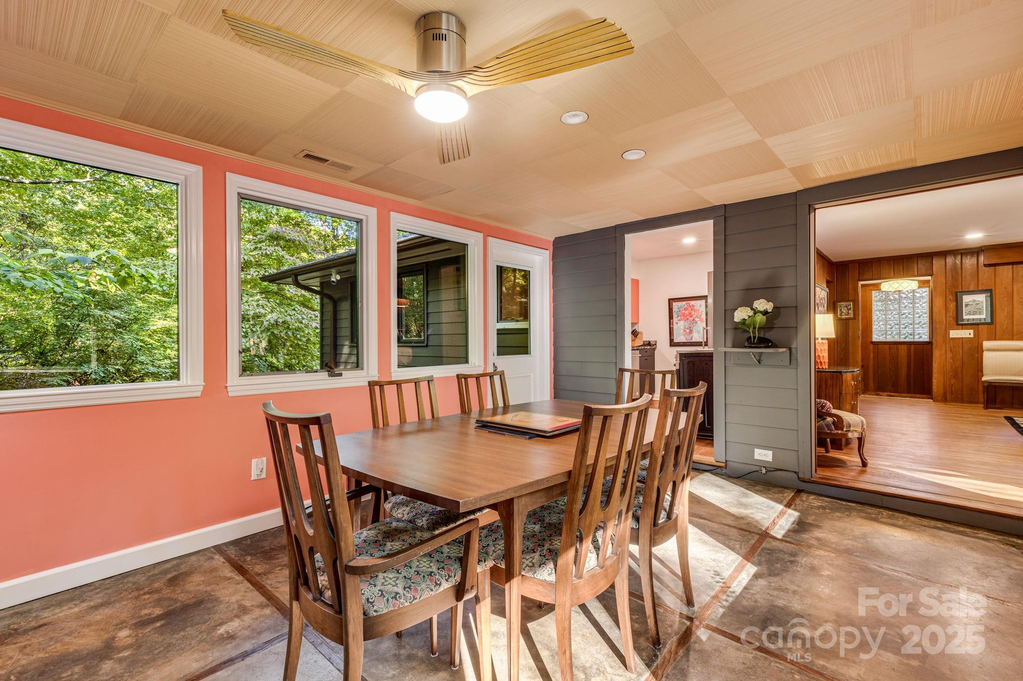 750 Braewick Road Tryon, NC 28782 - Photo 15 of 43 a view of a dining room with furniture window and wooden floor