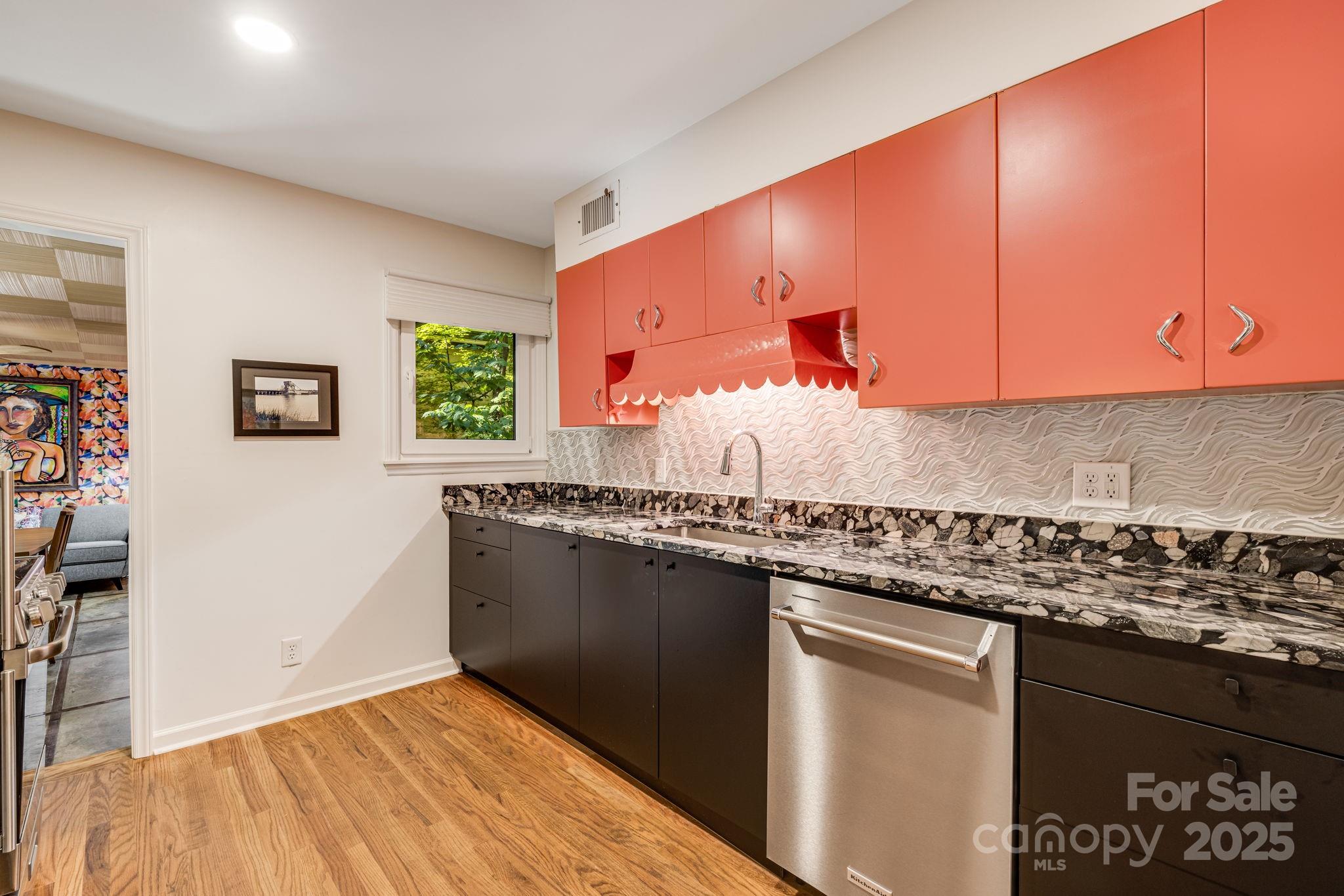 750 Braewick Road Tryon, NC 28782 - Photo 16 of 43 a kitchen with granite countertop a sink and a stove