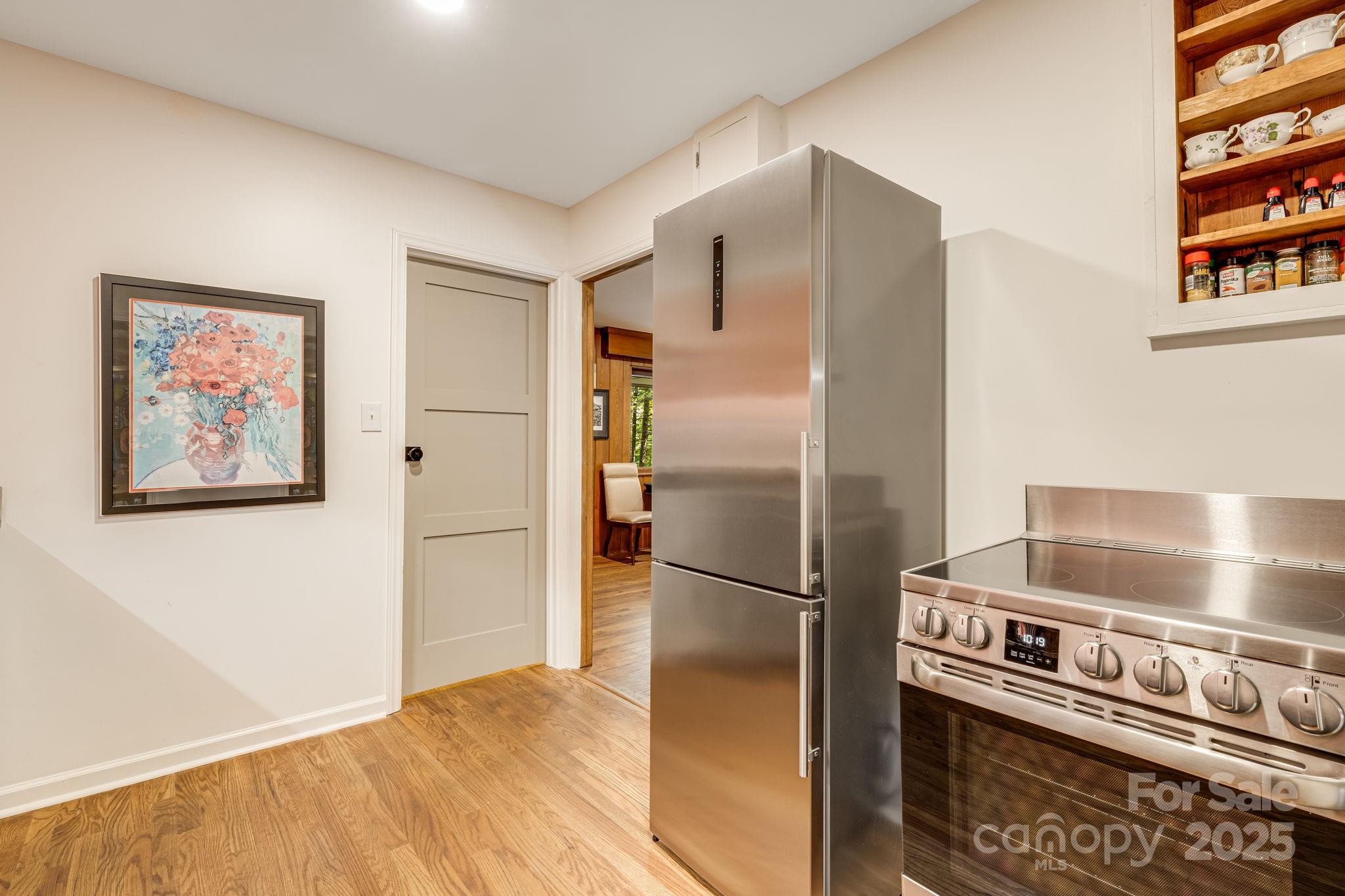 750 Braewick Road Tryon, NC 28782 - Photo 17 of 43 a metallic refrigerator freezer sitting in a kitchen