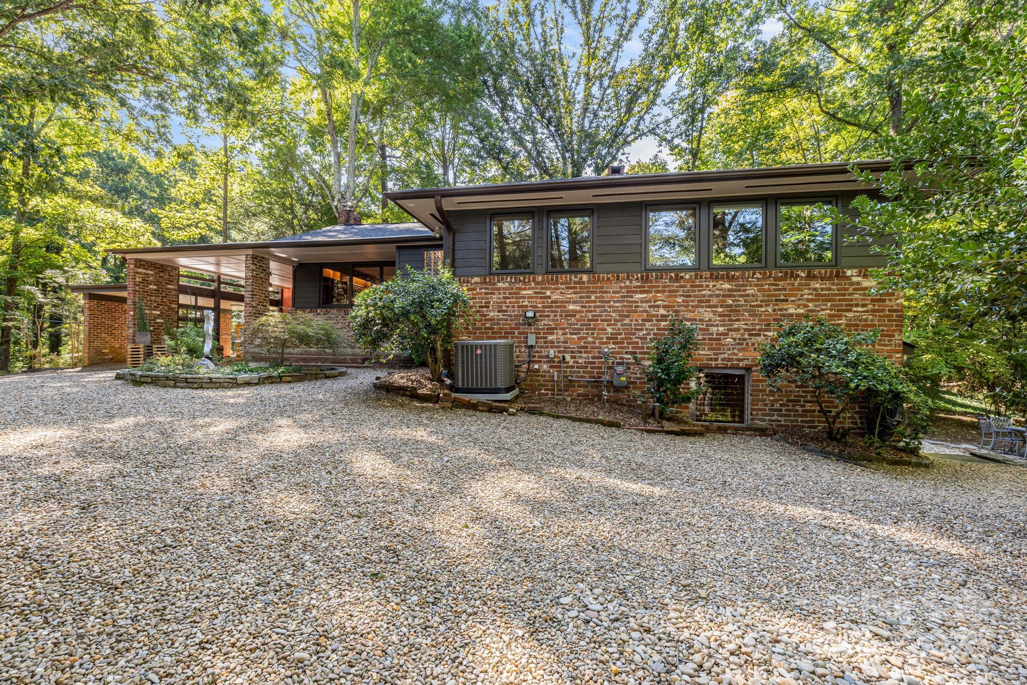750 Braewick Road Tryon, NC 28782 - Photo 2 of 43 front view of a house with a yard