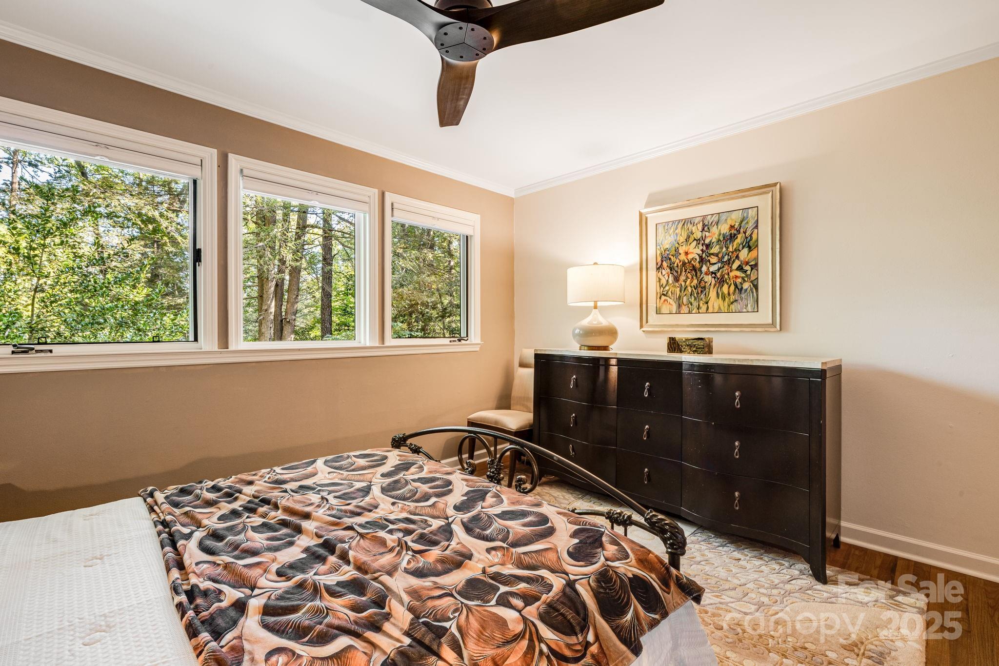 750 Braewick Road Tryon, NC 28782 - Photo 22 of 43 a bedroom with a bed and a window