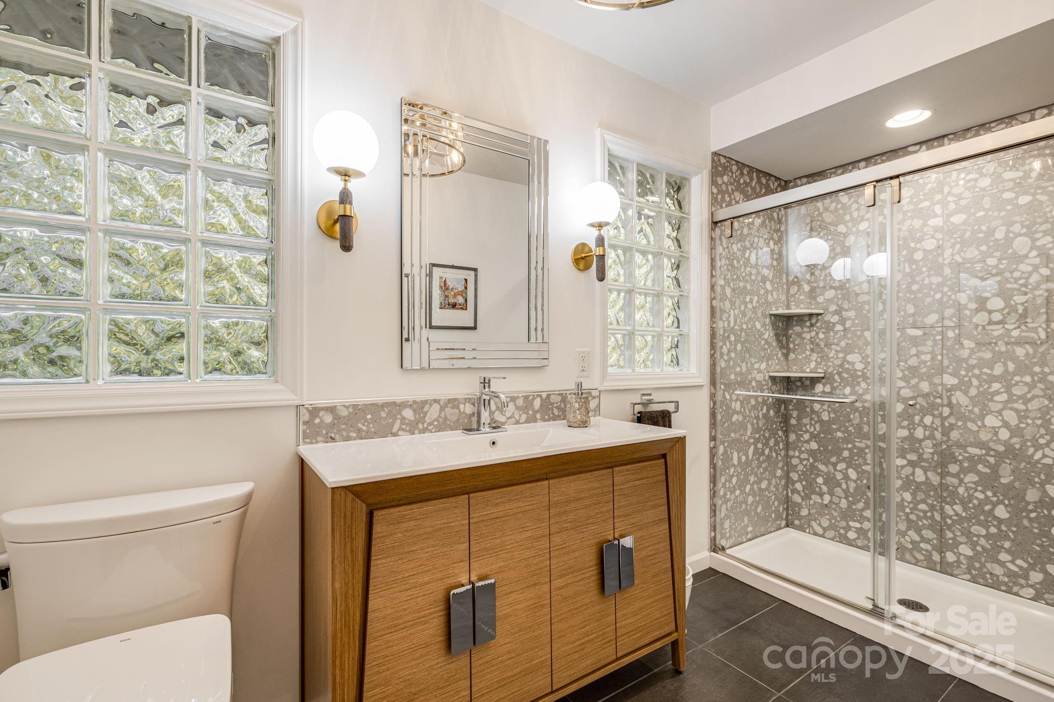 750 Braewick Road Tryon, NC 28782 - Photo 23 of 43 a bathroom with a sink toilet and shower