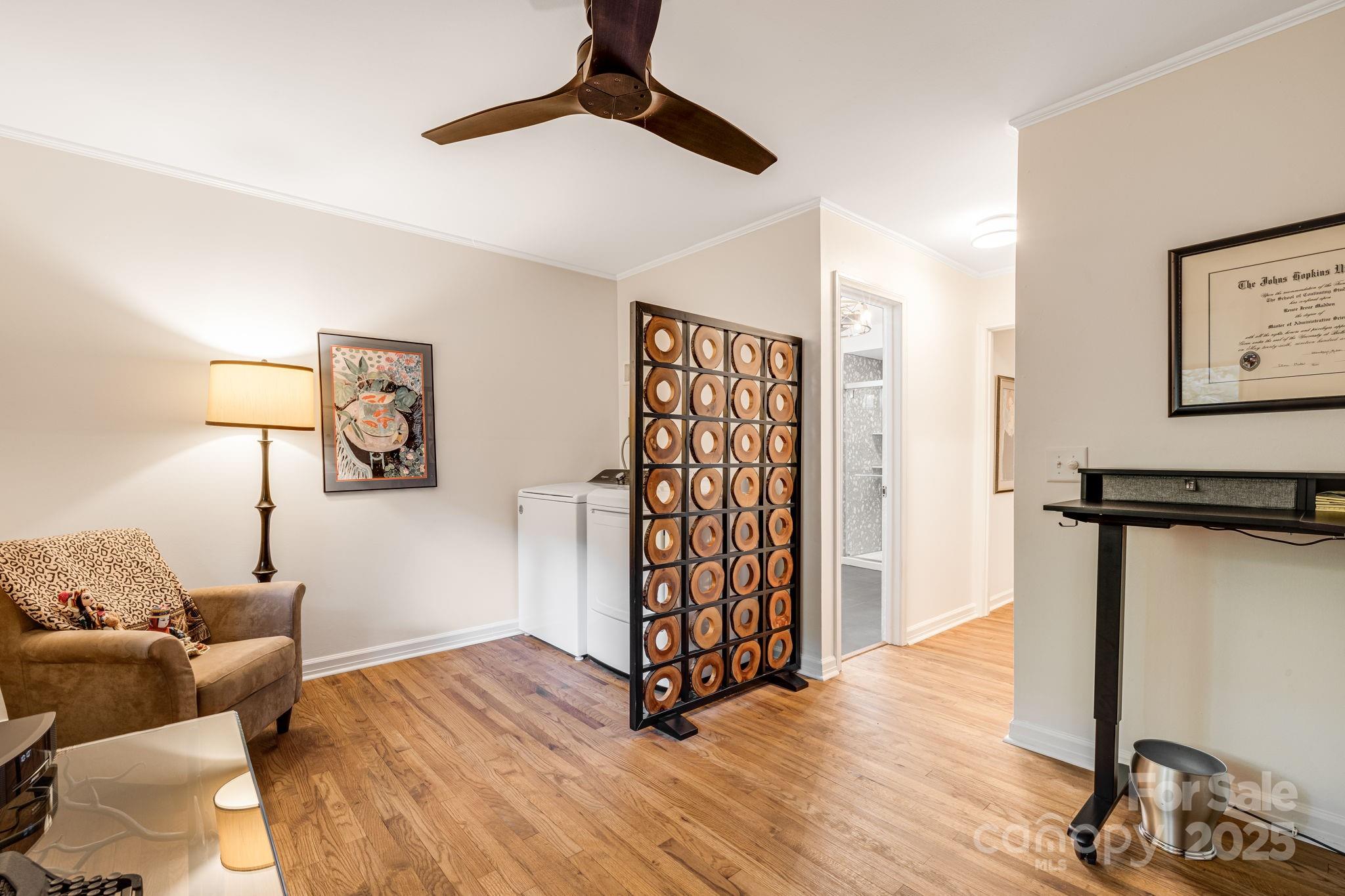 750 Braewick Road Tryon, NC 28782 - Photo 25 of 43 a bedroom with furniture and a wooden floor
