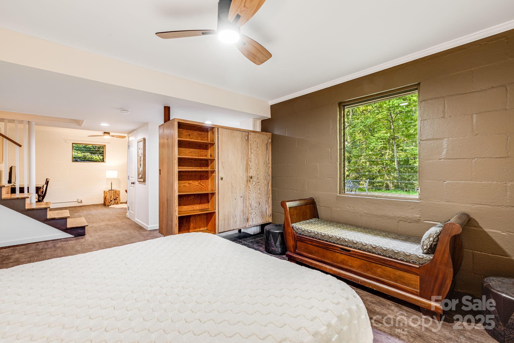 750 Braewick Road Tryon, NC 28782 - Photo 28 of 43 a bedroom with a bed and furniture