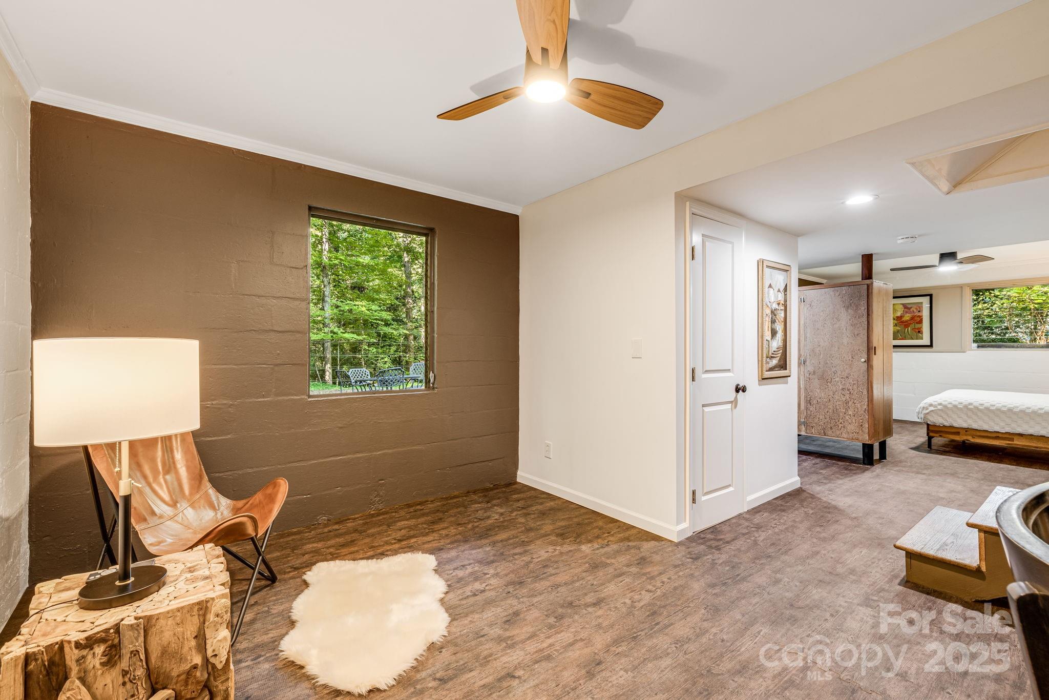 750 Braewick Road Tryon, NC 28782 - Photo 29 of 43 a view of a livingroom with furniture and a window