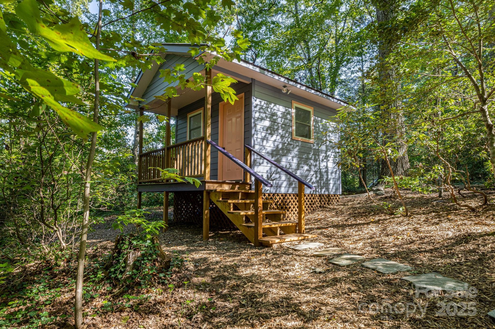 750 Braewick Road Tryon, NC 28782 - Photo 31 of 43 a view of a house with a yard