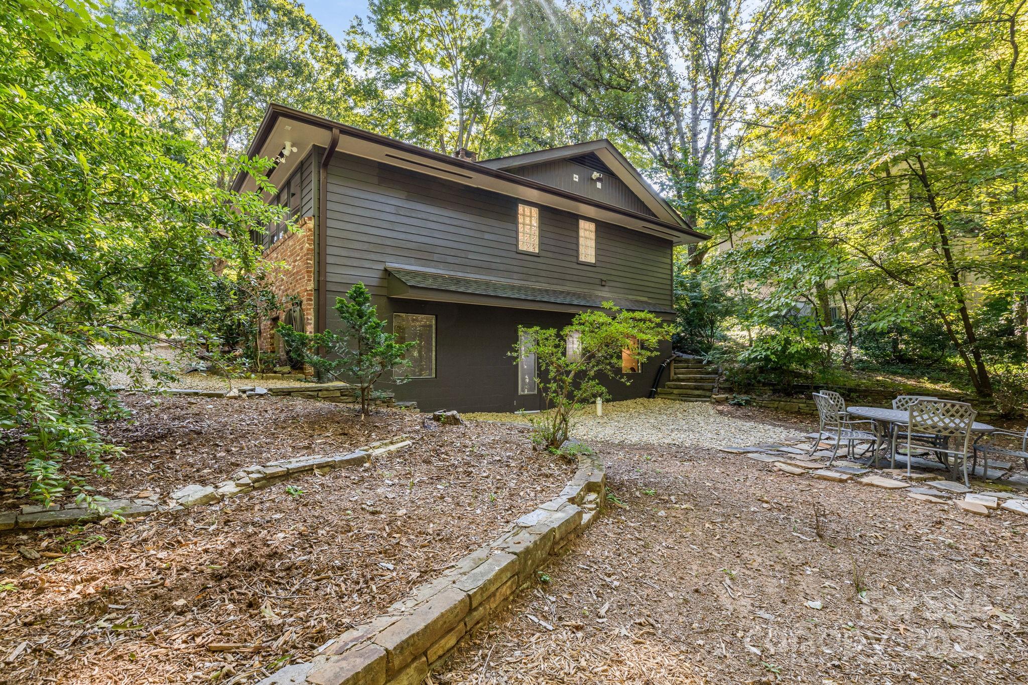 750 Braewick Road Tryon, NC 28782 - Photo 33 of 43 a front view of a house with garden