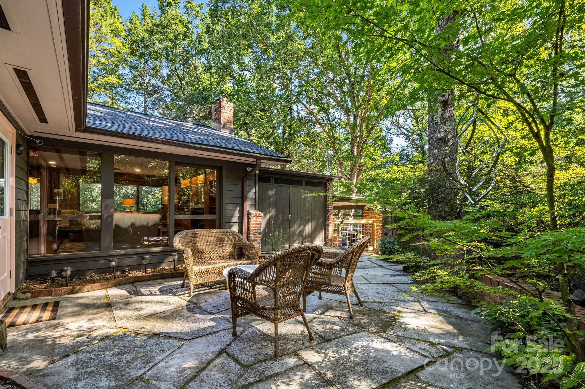 750 Braewick Road Tryon, NC 28782 - Photo 34 of 43 a view of backyard with outdoor seating and green space