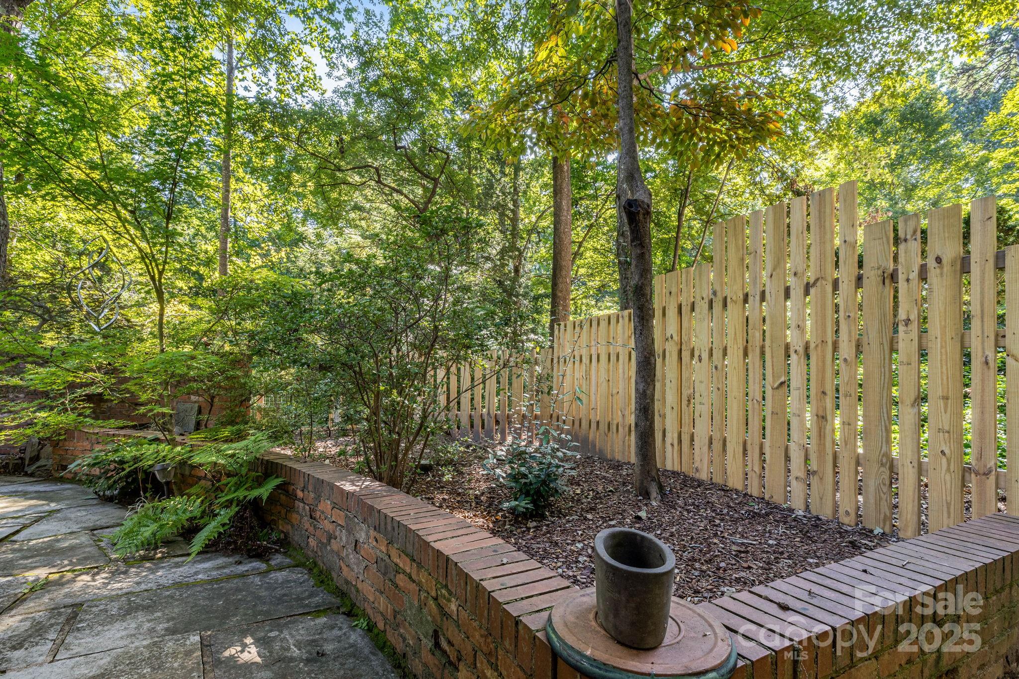 750 Braewick Road Tryon, NC 28782 - Photo 37 of 43 a view of potted plants in backyard of a house