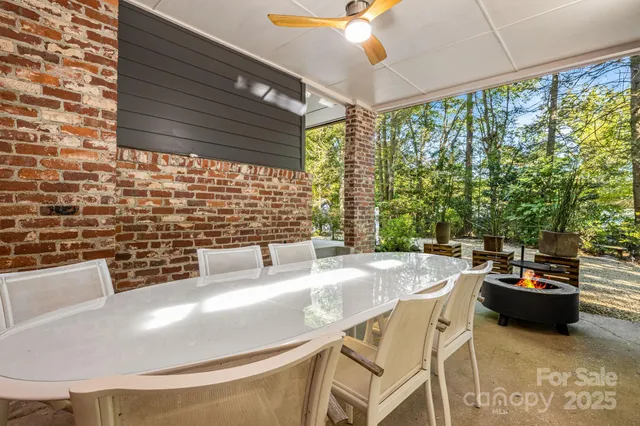 a dining table with chairs and window