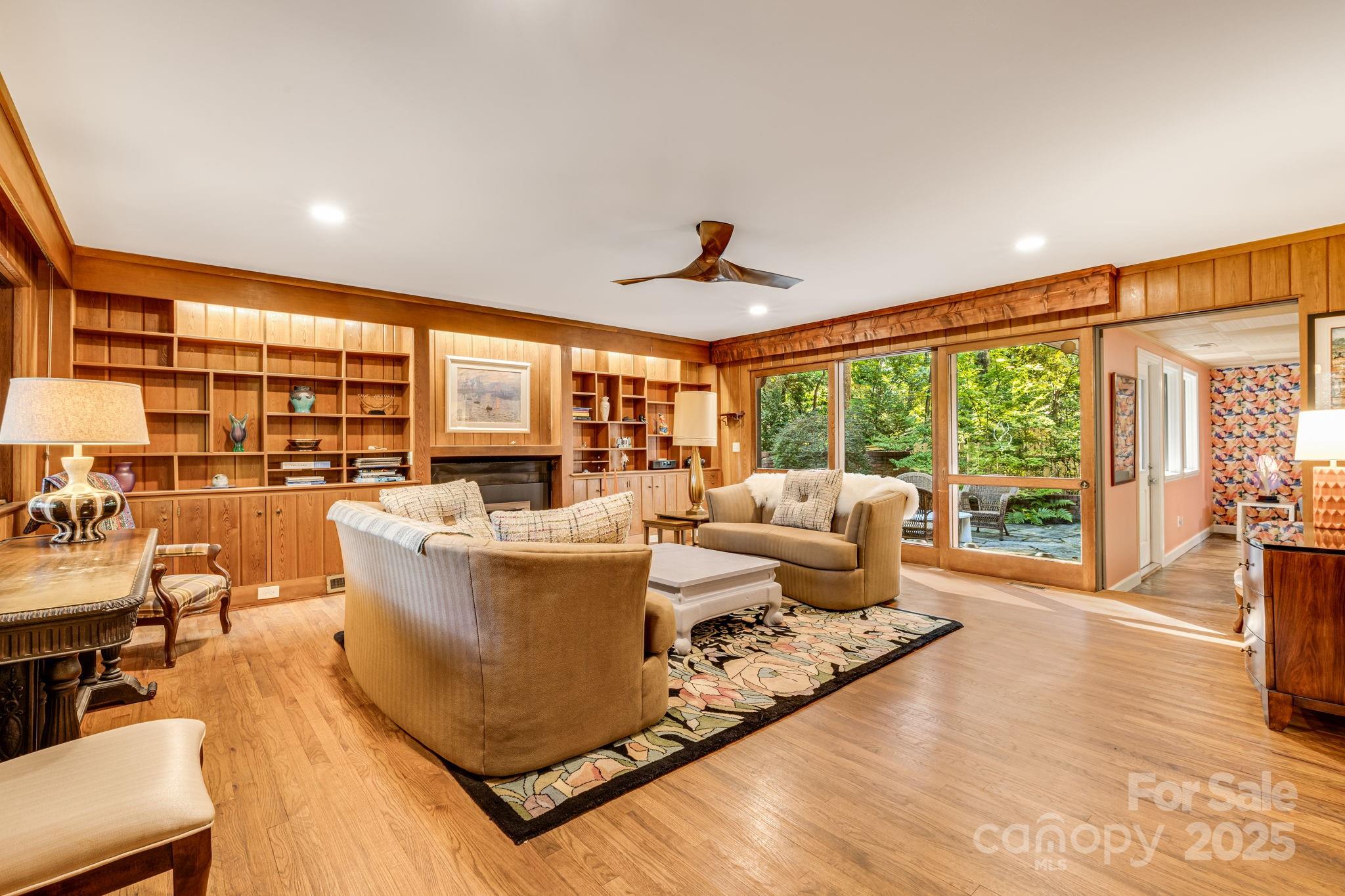 750 Braewick Road Tryon, NC 28782 - Photo 10 of 43 a living room with furniture and large windows