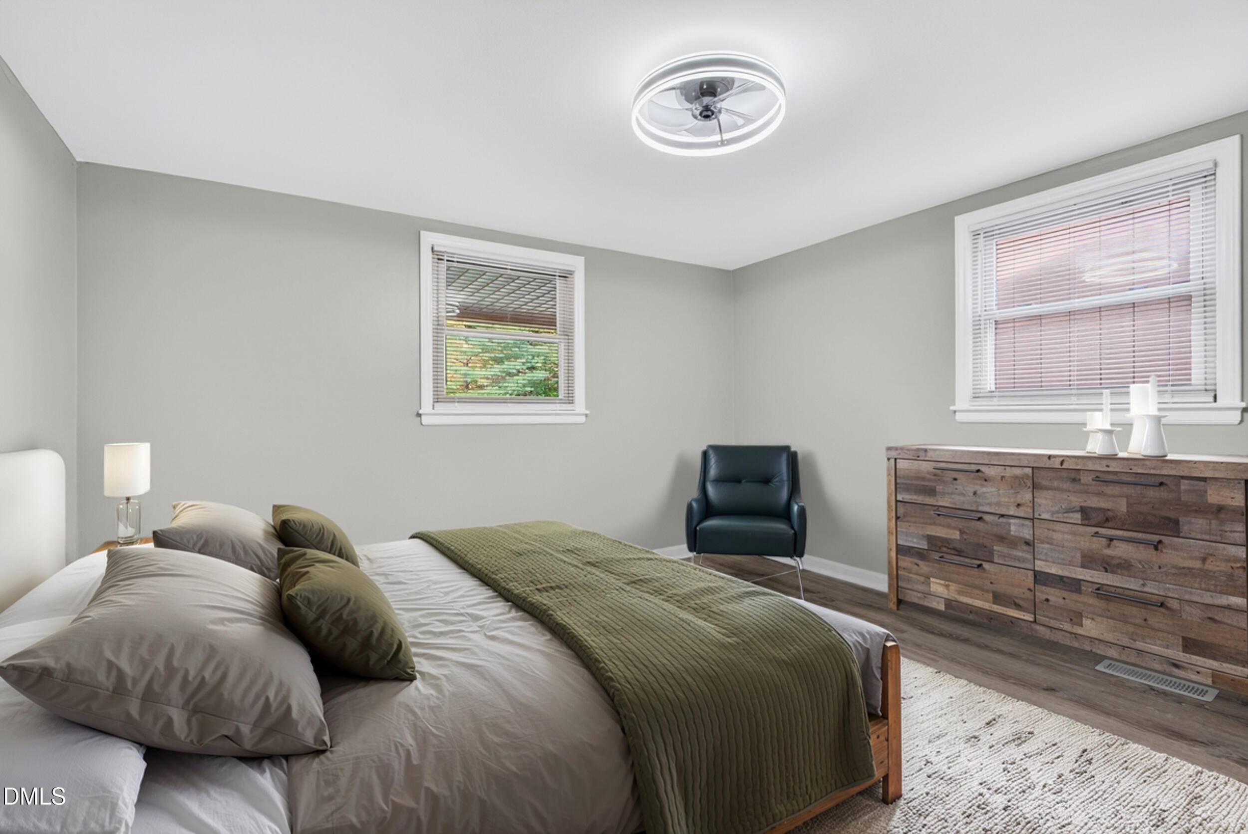 205 Bacon Road Rougemont, NC 27572 - Photo 15 of 29 a bedroom with a bed and a chandelier