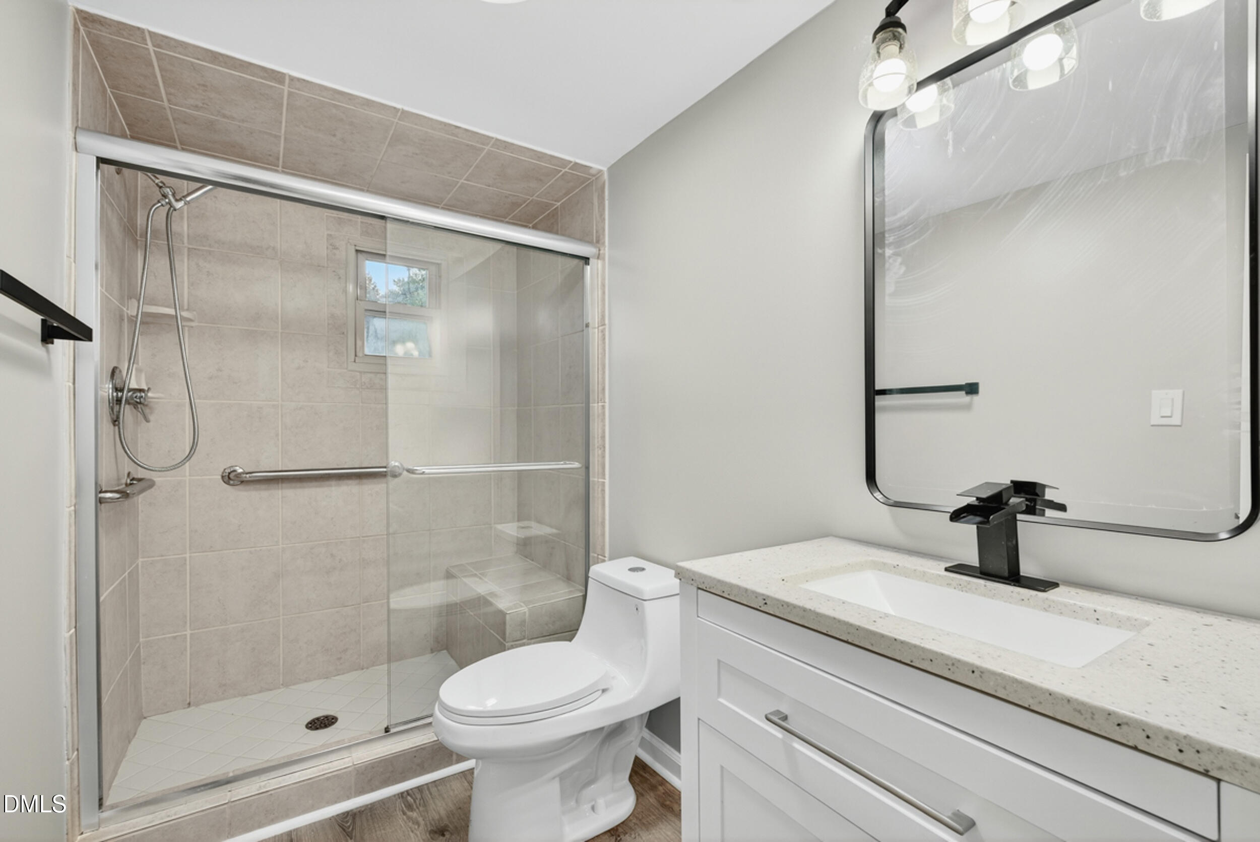 205 Bacon Road Rougemont, NC 27572 - Photo 18 of 29 a bathroom with a sink a toilet and shower