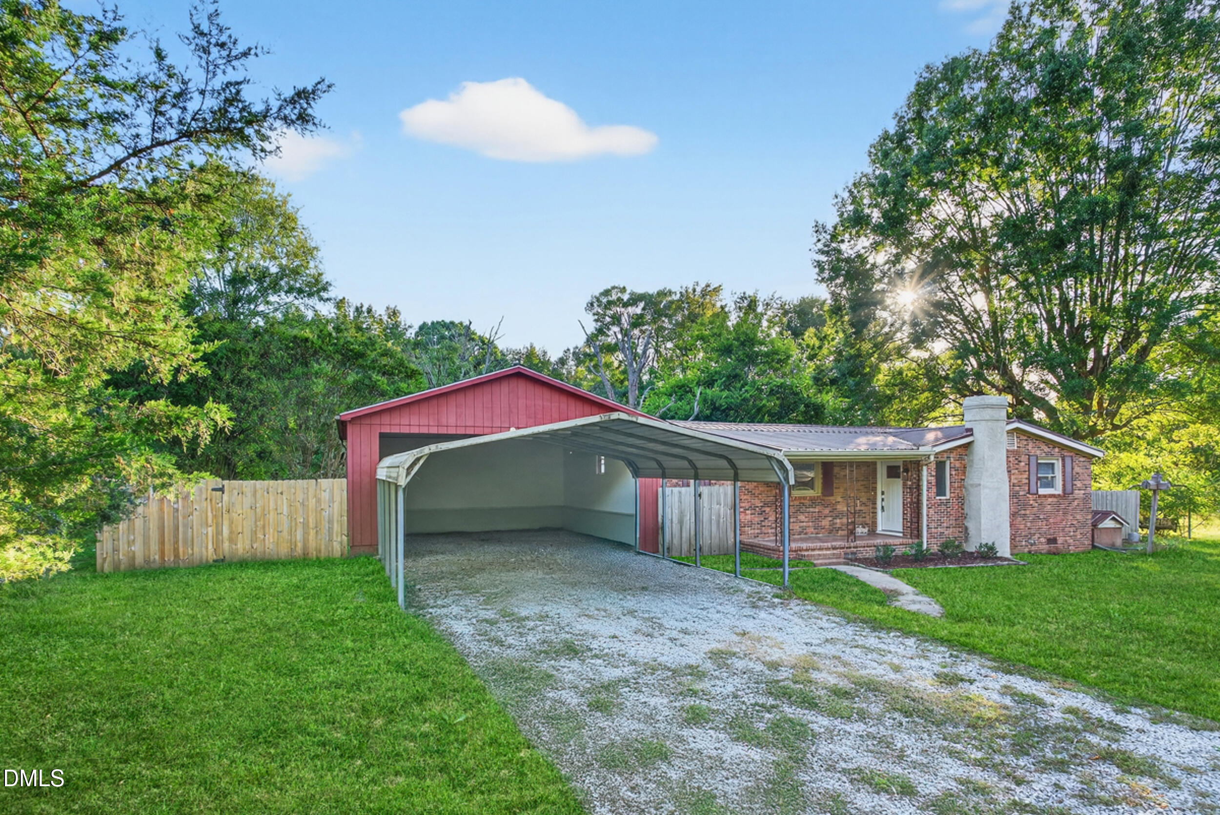 205 Bacon Road Rougemont, NC 27572 - Photo 3 of 29 a view of a house with a yard and a large tree
